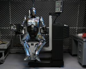 RoboCop Figura Ultimate Battle Damaged RoboCop with Chair