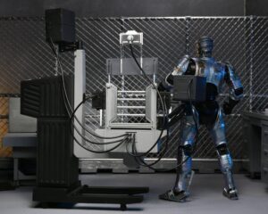 RoboCop Figura Ultimate Battle Damaged RoboCop with Chair