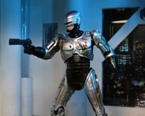RoboCop Figura Ultimate Battle Damaged RoboCop with Chair